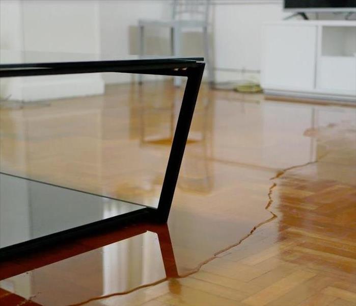 water covering the floor of a living room
