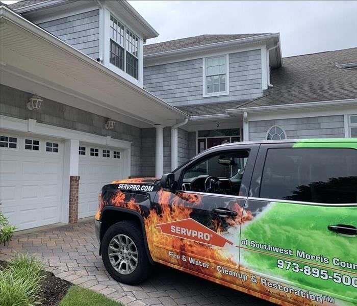 SERVPRO SUV Wrapped in Logo Design Parked in Client Driveway