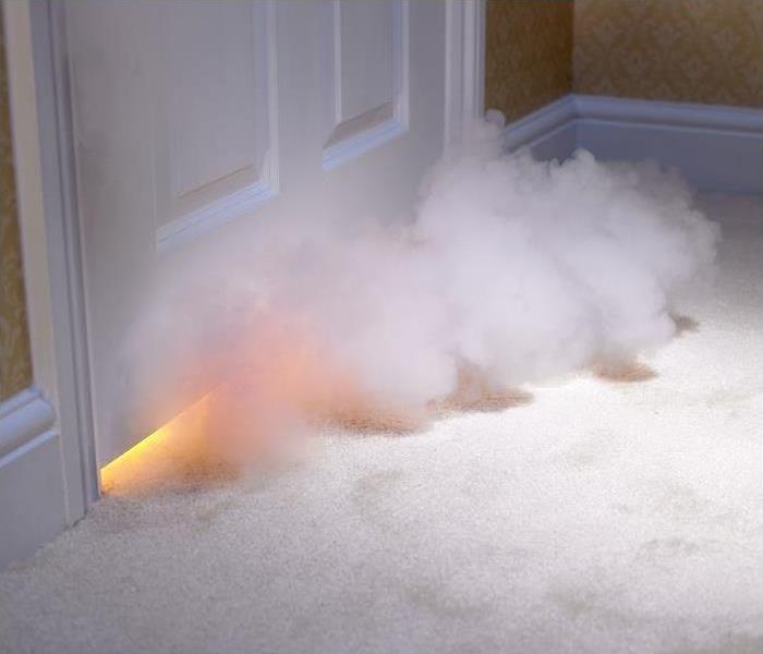 smoke entering room from below door