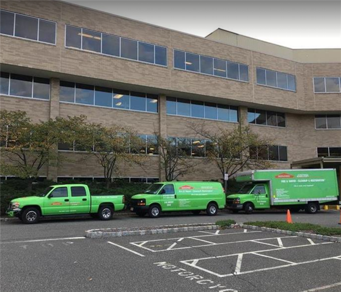 SERVPRO vehicles parked in front of commercial building