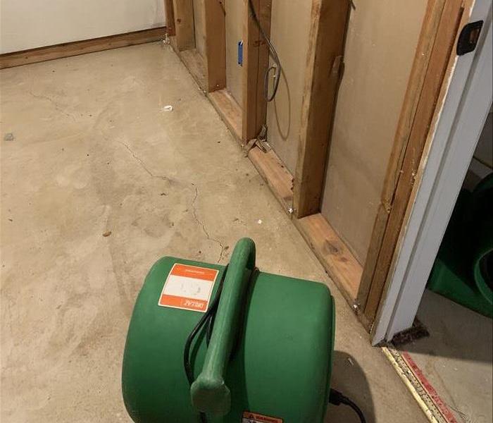 Air mover drying out walls and floor 